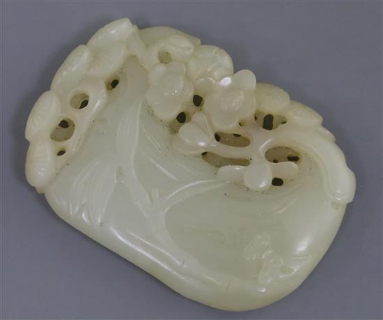 A Chinese pale celadon jade plaque, 6.2cm